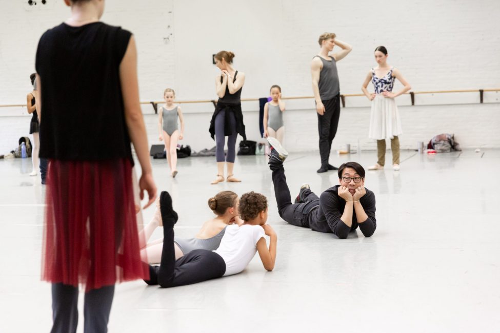 Edwaard Liang works with students during Cinderella performance rehearsal