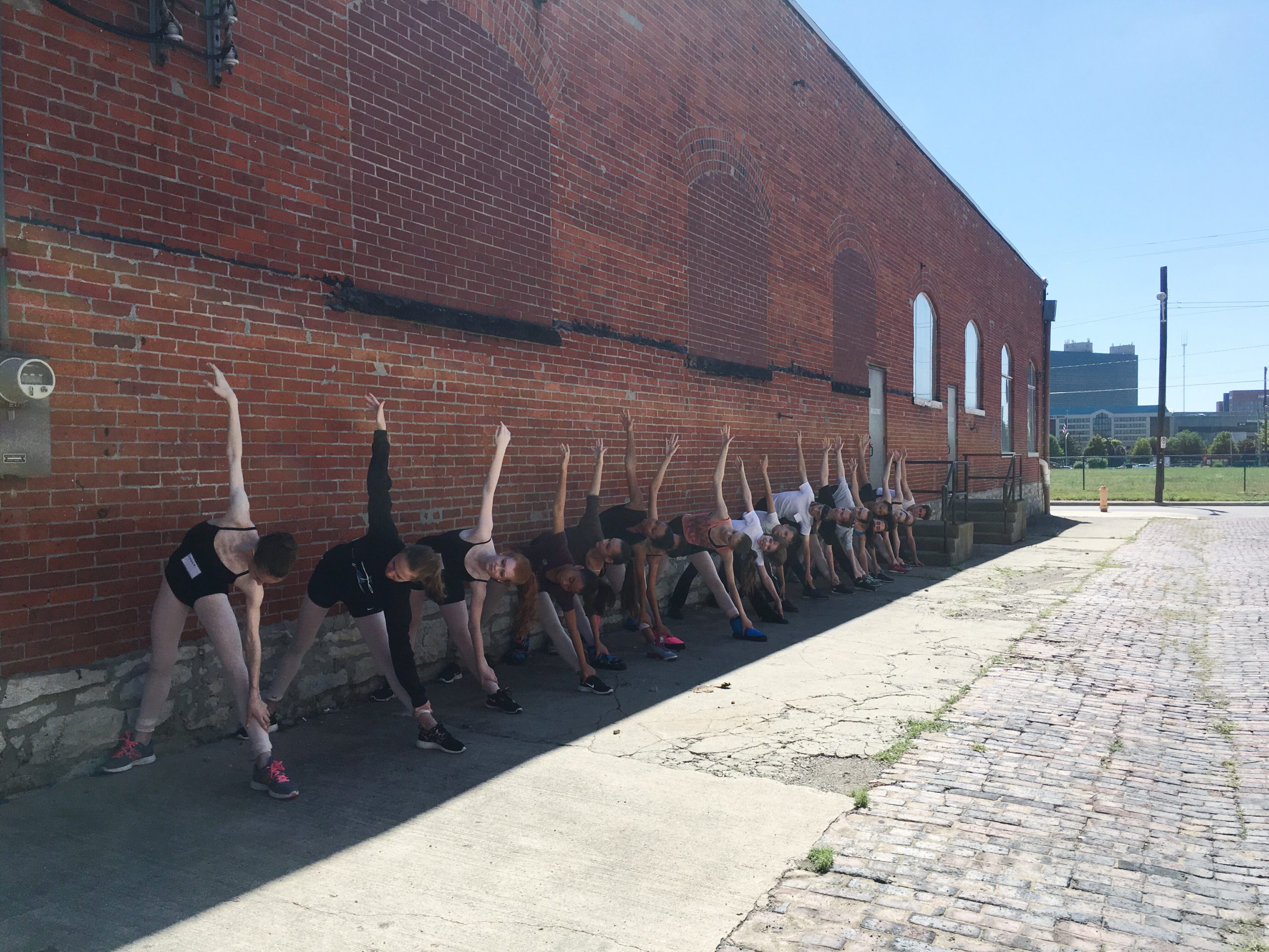 Summer intensive students take an outdoor yoga class