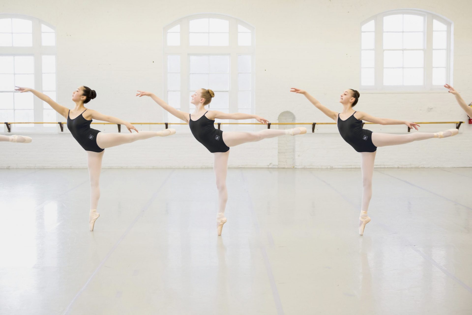 Academy students posing in leotards