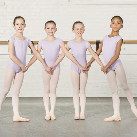 Academy students posing in leotards