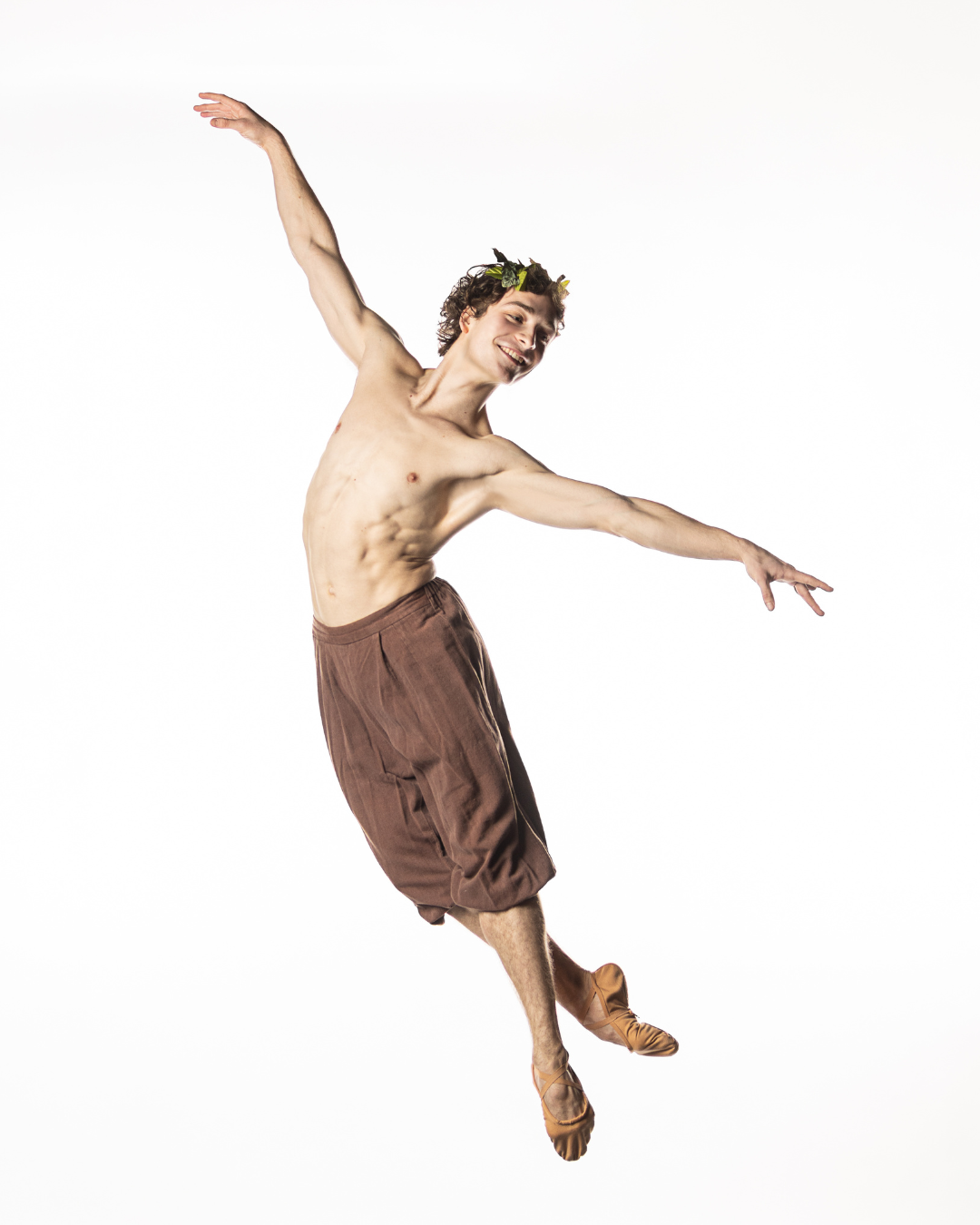 BalletMet dancer poses in the air while portraying Peter Pan
