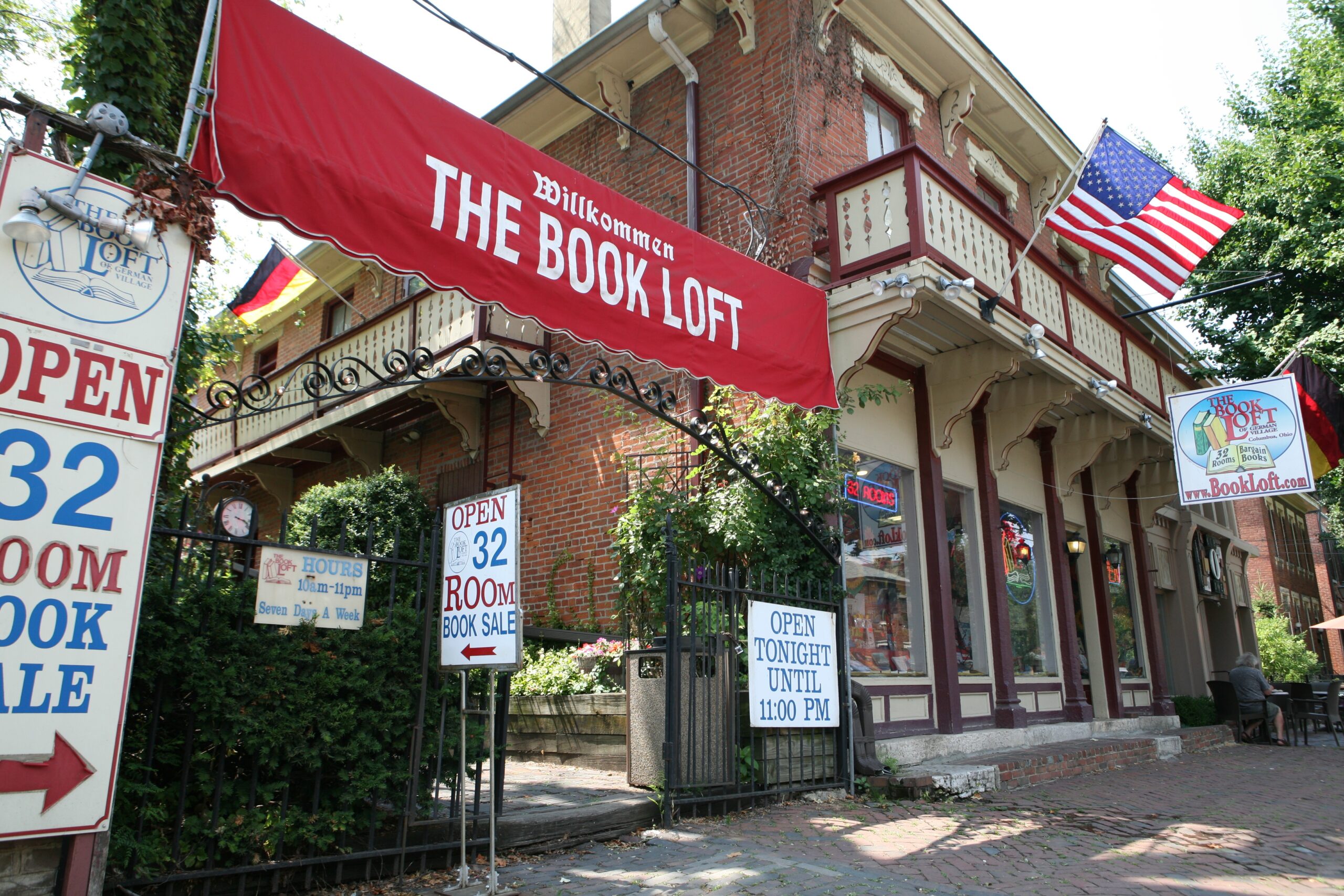 Image of the outside of The Book Loft featuring shop signs in the German Village neighborhood.